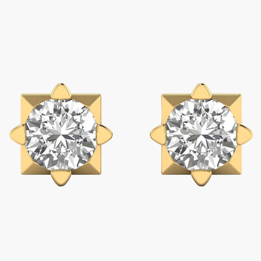 Pair of gold earrings with clear gemstones on a white background