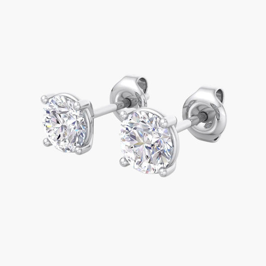 Pair of diamond stud earrings on a white background