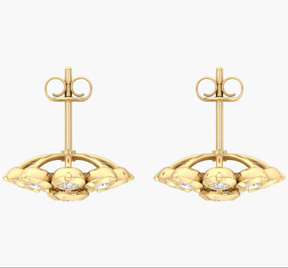 Pair of gold earrings with a white background