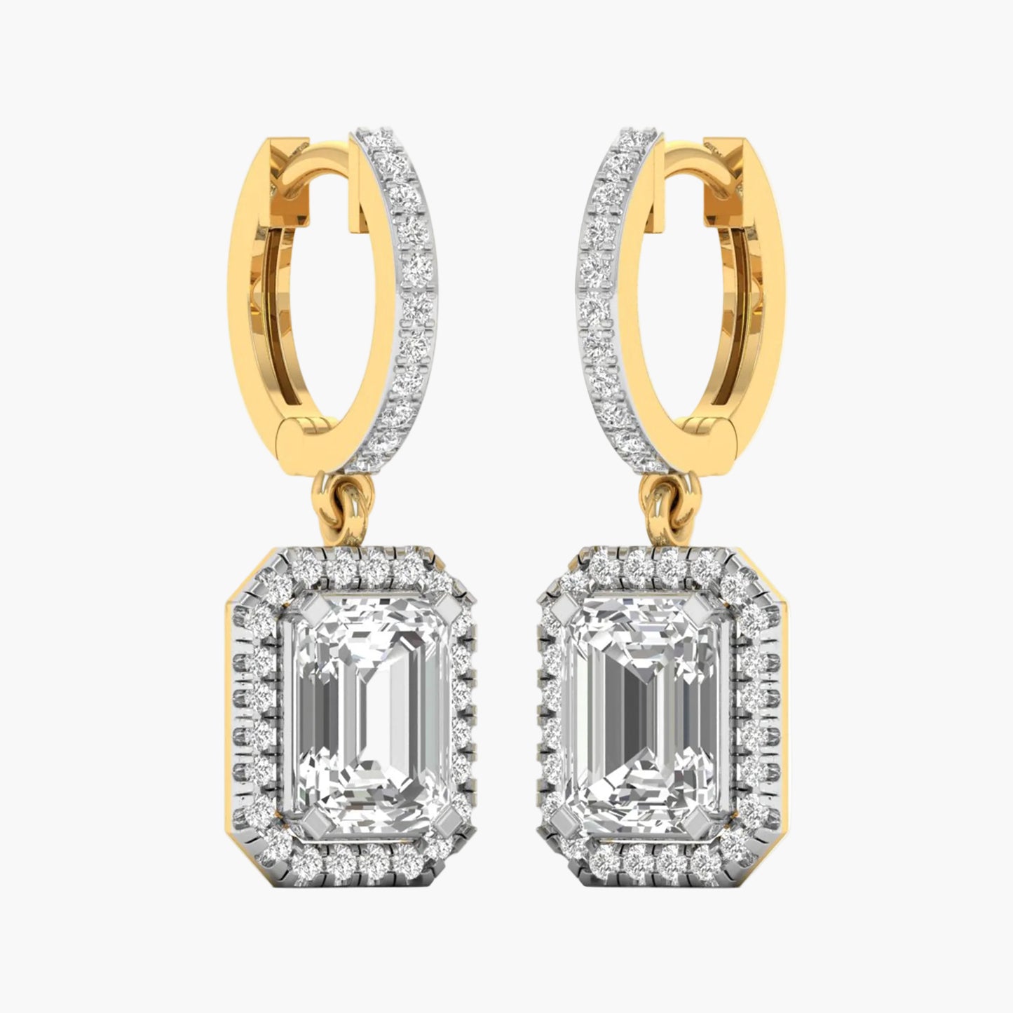 Gold and diamond earrings on a white background