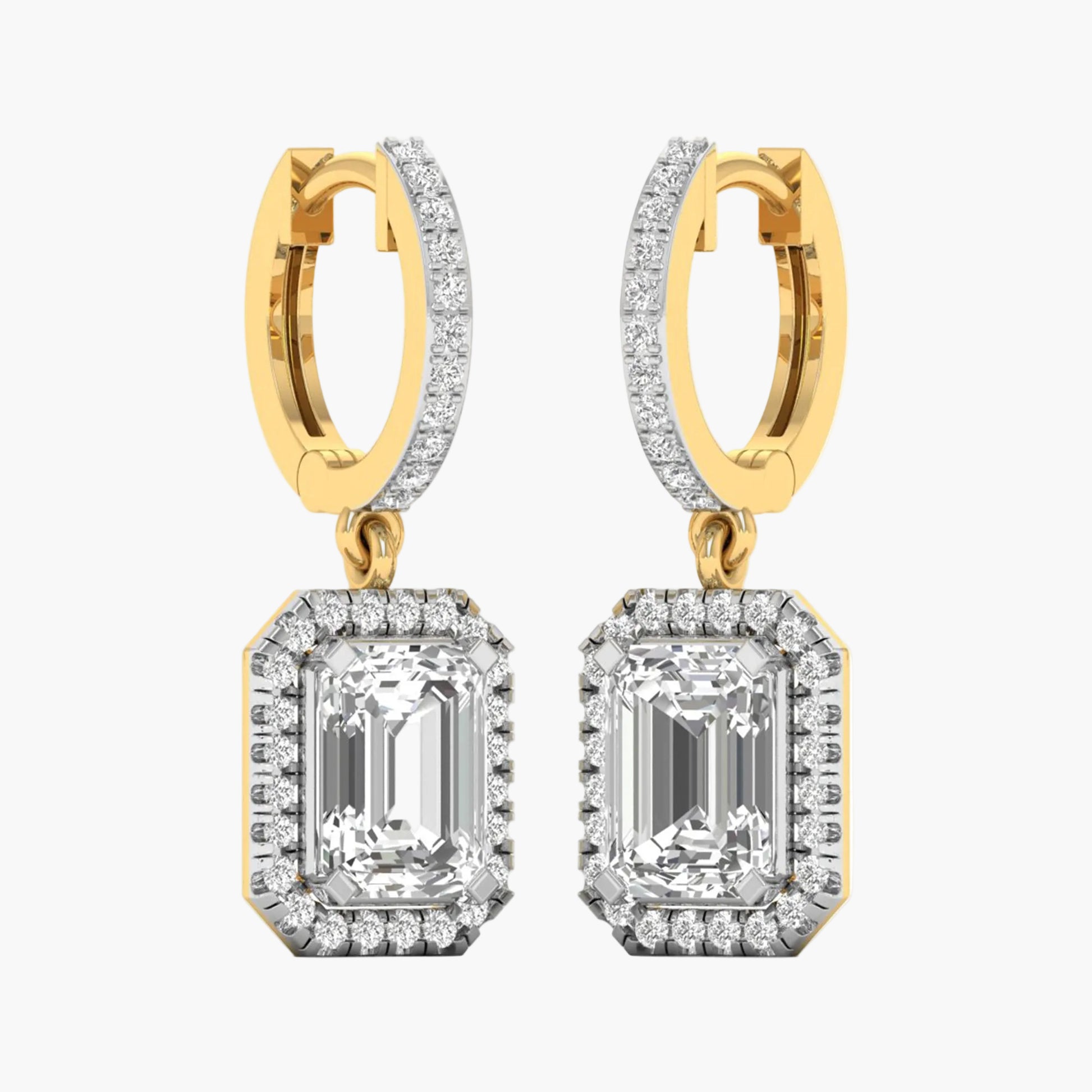 Gold and diamond earrings on a white background