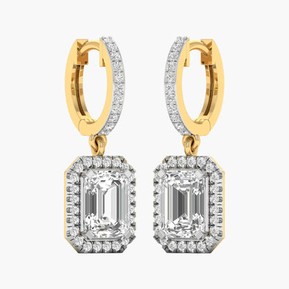 Gold and diamond earrings on a white background