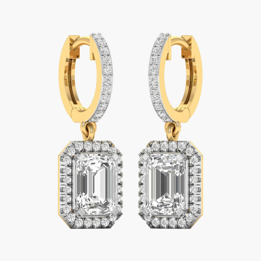 Gold and diamond earrings on a white background