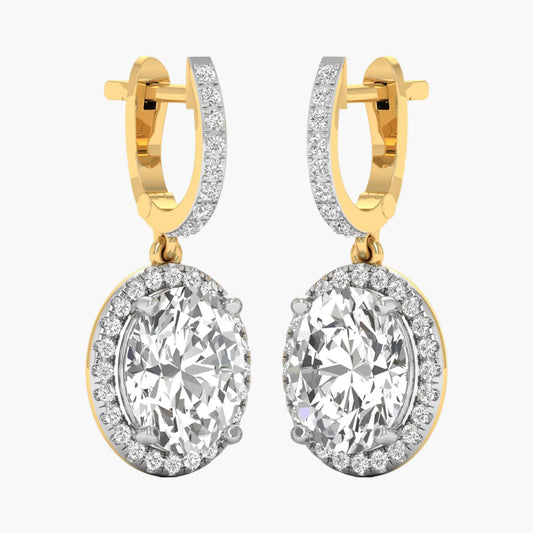 Gold hoop earrings with large clear gemstones on a white background