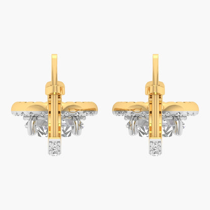 Gold and silver earrings on a white background