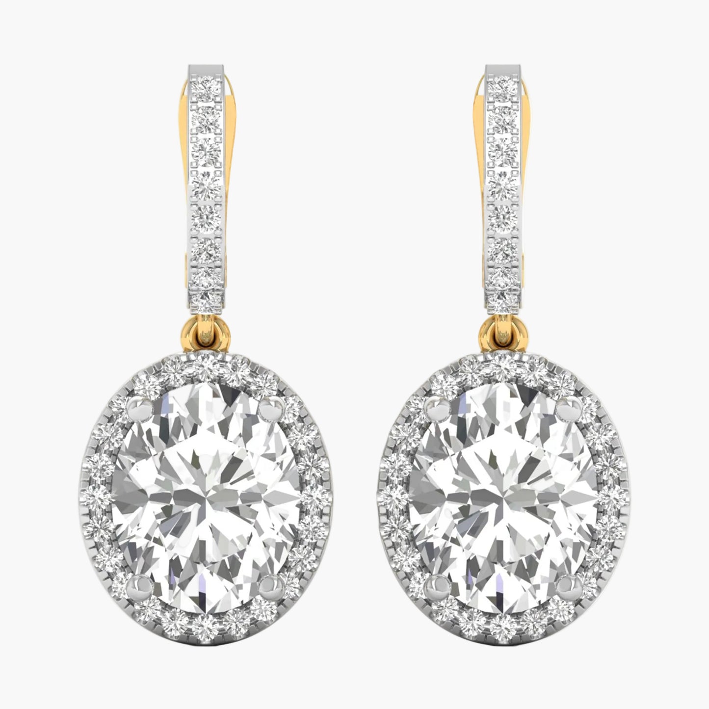 Diamond earrings with gold and clear stones on a white background