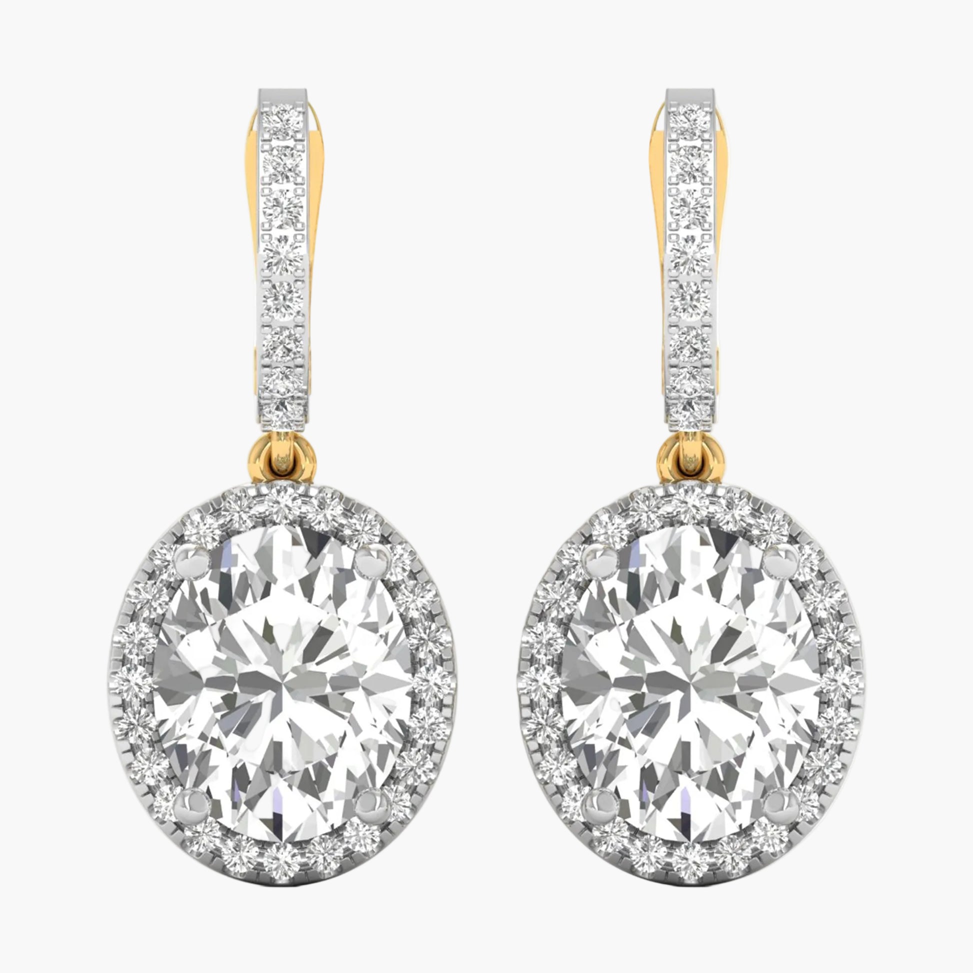Diamond earrings with gold and clear stones on a white background
