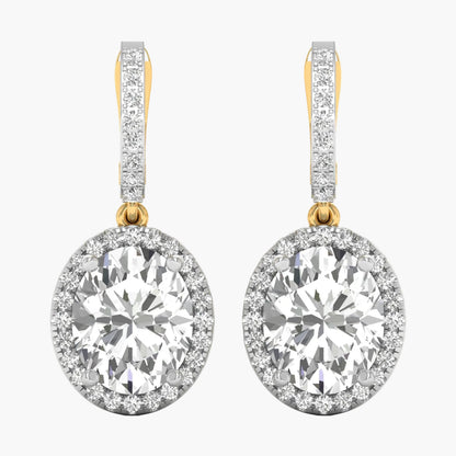 Diamond earrings with gold and clear stones on a white background