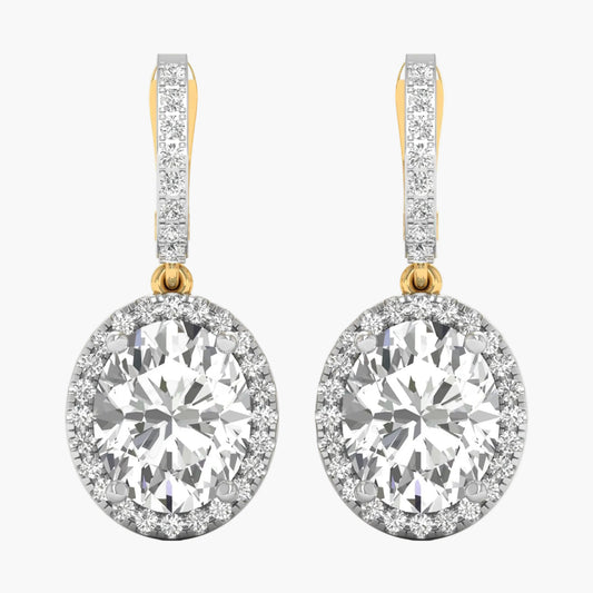 Diamond earrings with gold and clear stones on a white background