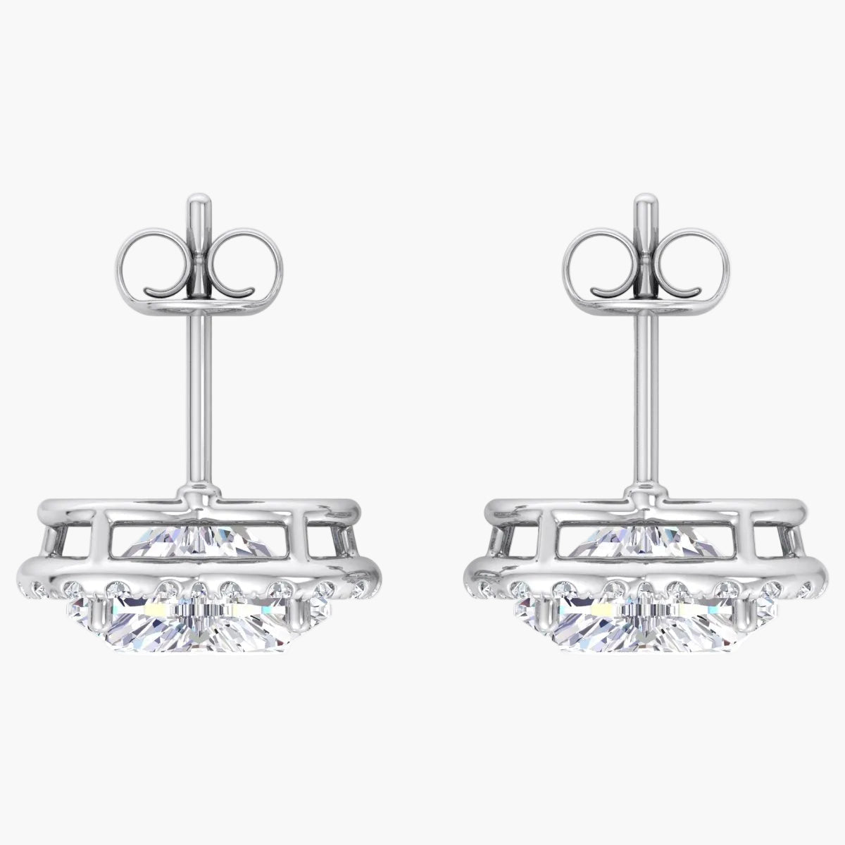 Pair of silver earrings with clear gemstones on a white background