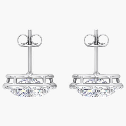 Pair of silver earrings with clear gemstones on a white background