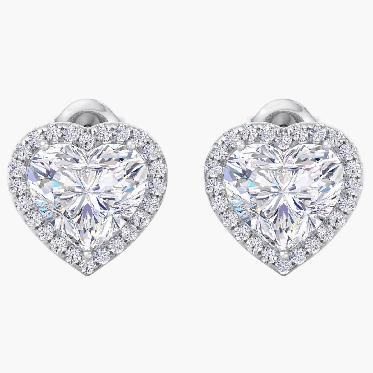 Heart-shaped diamond earrings on a white background