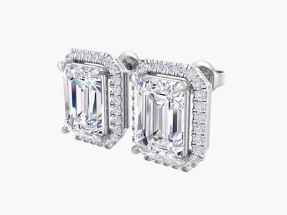 Diamond earrings with emerald-cut stones on a white background