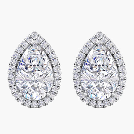 Pair of teardrop-shaped diamond earrings on a white background