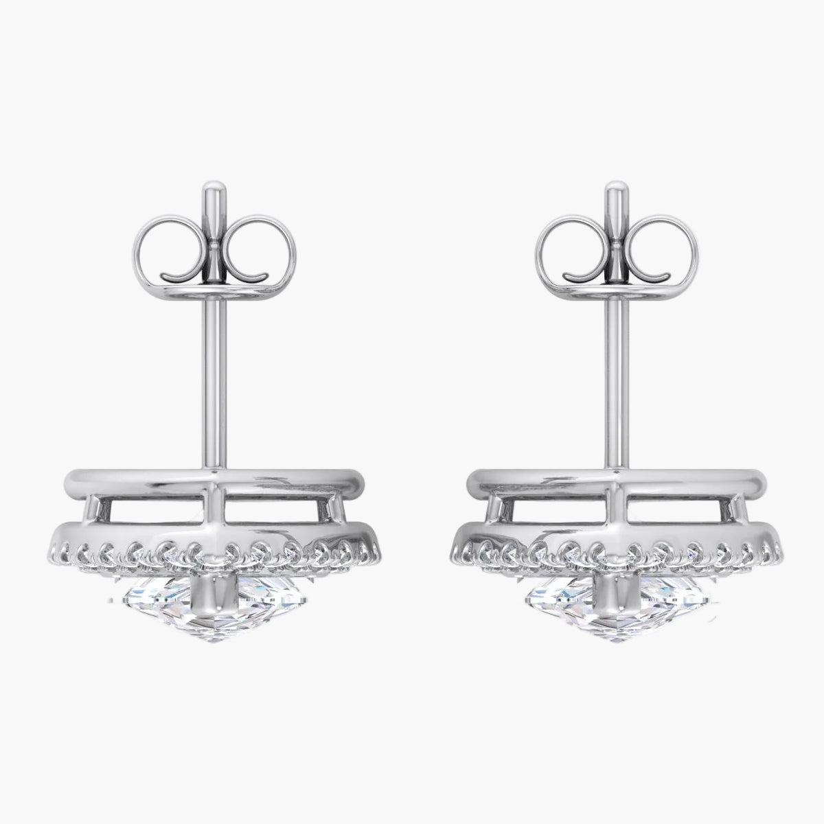 Pair of silver earrings with intricate designs on a white background