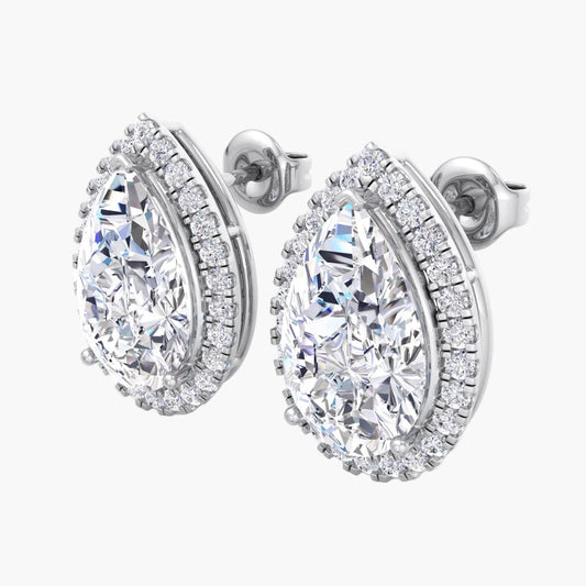Pair of diamond earrings on a white background