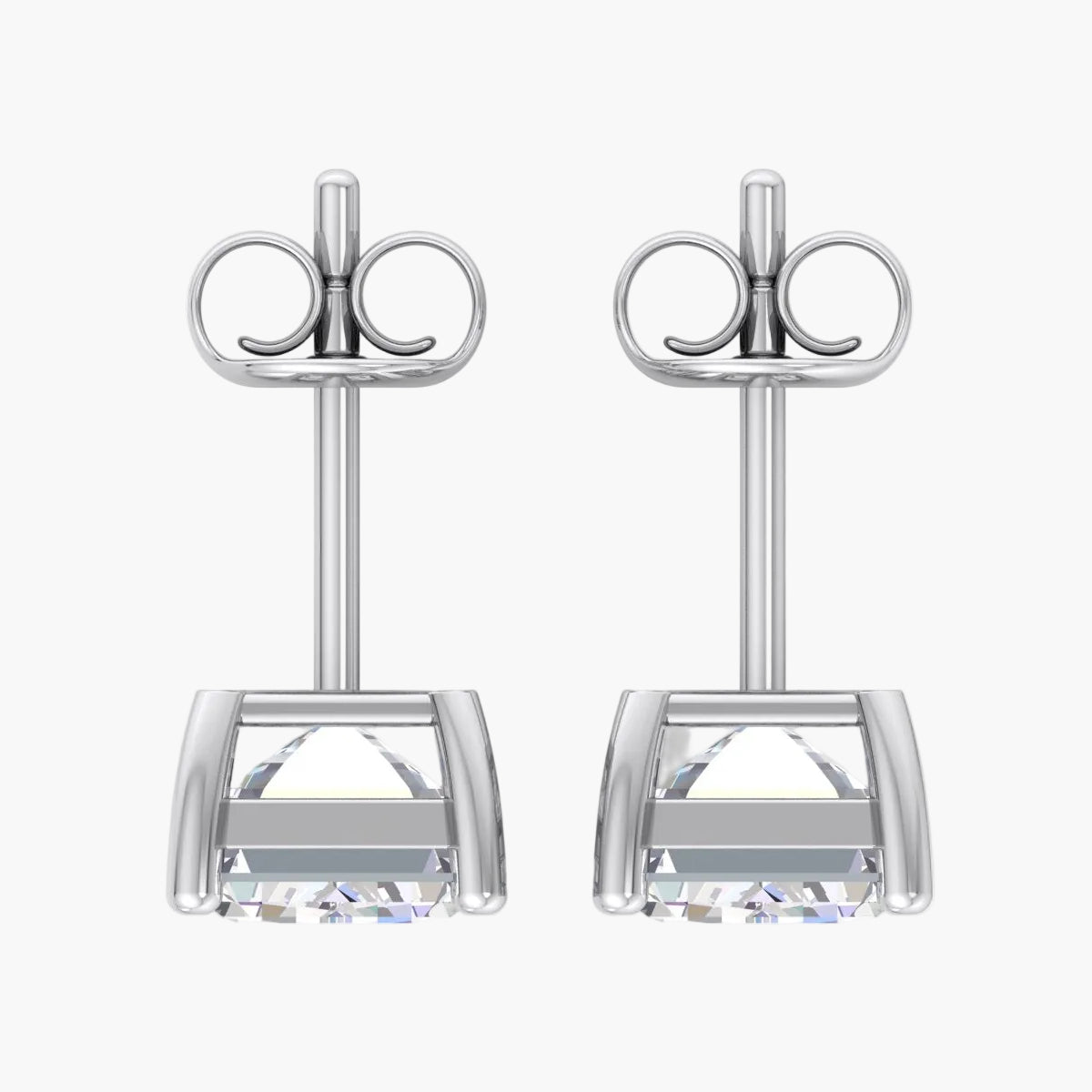 Pair of silver stud earrings on a white background