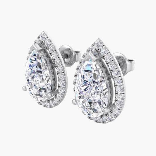 Pair of diamond earrings on a white background