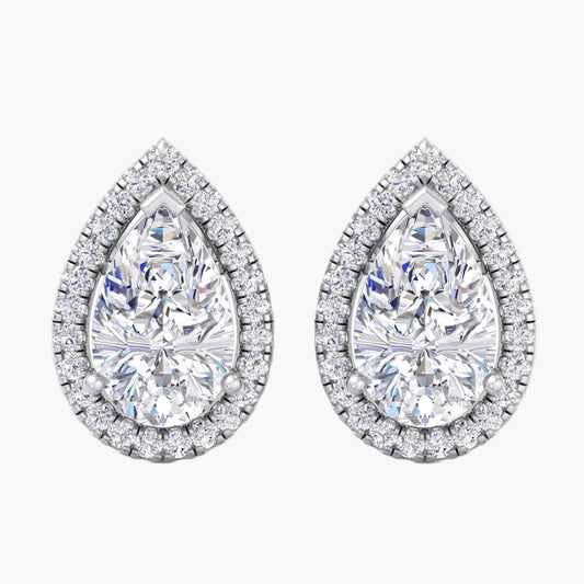 Pair of teardrop-shaped diamond earrings on a white background