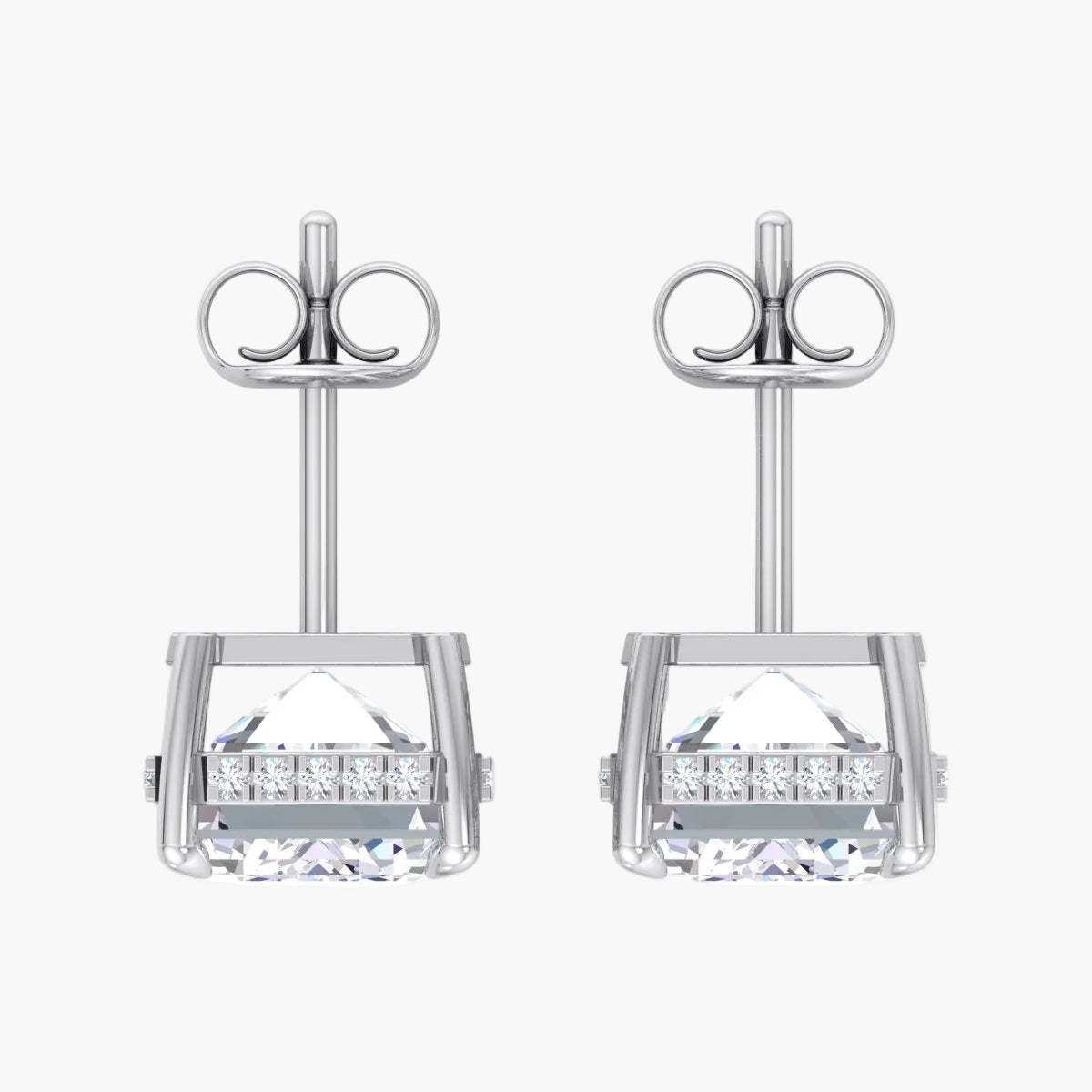 Pair of silver earrings with clear gemstones on a white background