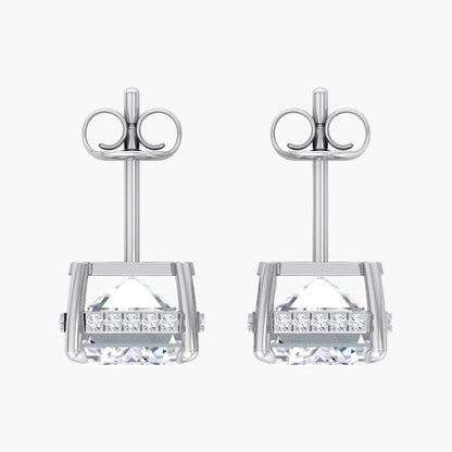 Pair of silver earrings with clear gemstones on a white background