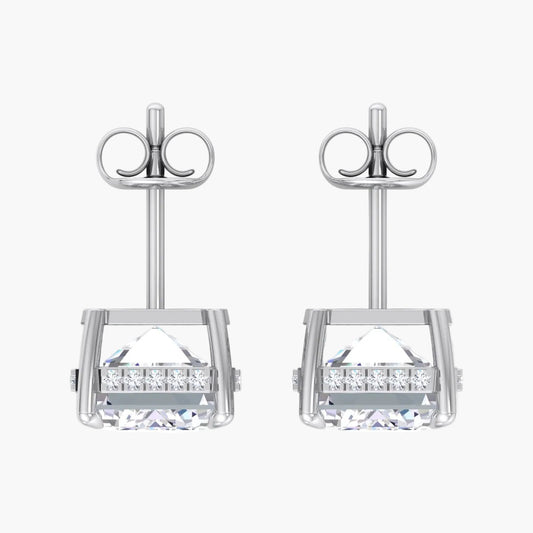 Pair of silver earrings with clear gemstones on a white background