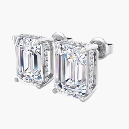 Pair of diamond stud earrings on a white background