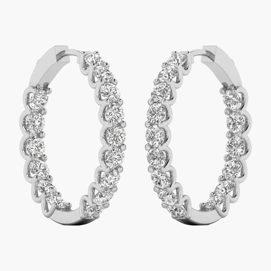 Pair of diamond hoop earrings on a white background