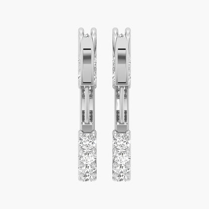 Pair of diamond earrings on a white background