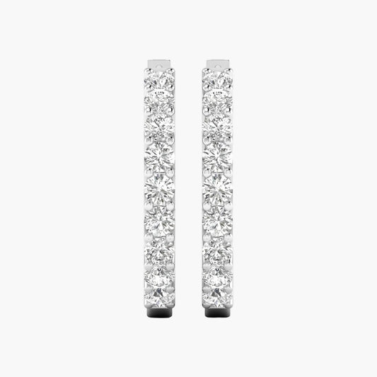 Pair of diamond hoop earrings on a white background