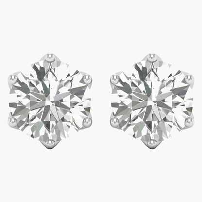 Pair of diamond stud earrings on a white background