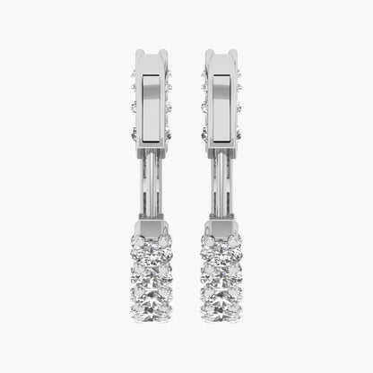 Pair of diamond earrings on a white background
