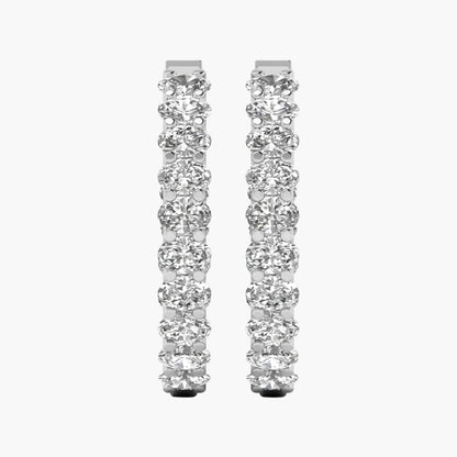 Pair of diamond hoop earrings on a white background
