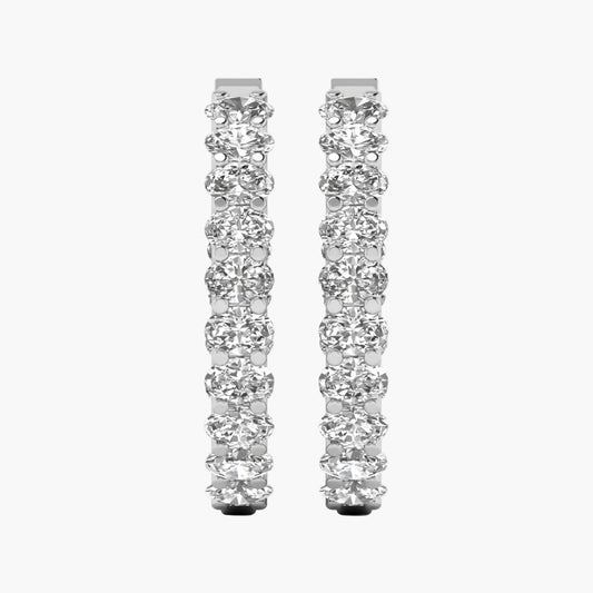 Pair of diamond hoop earrings on a white background