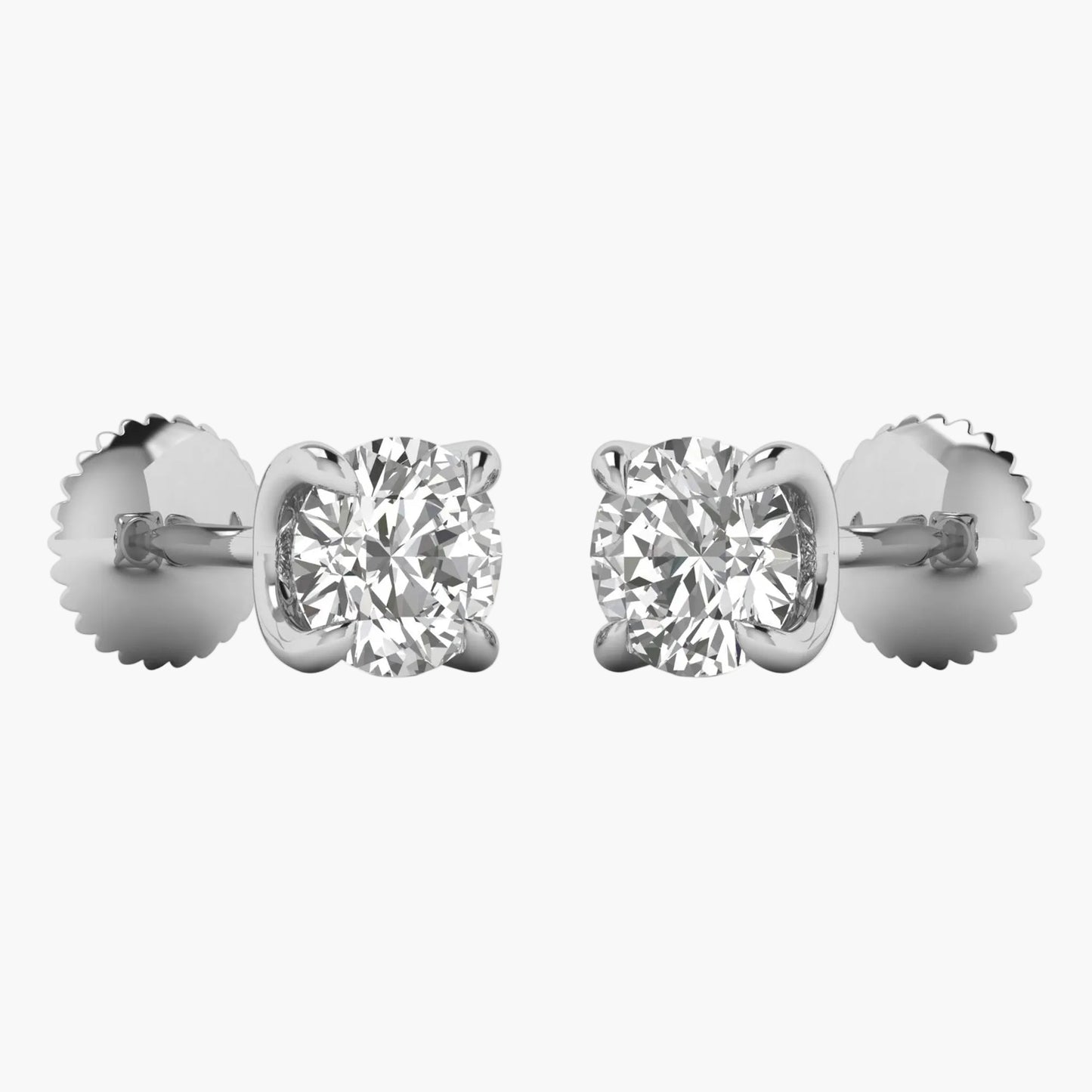 Pair of diamond stud earrings on a white background