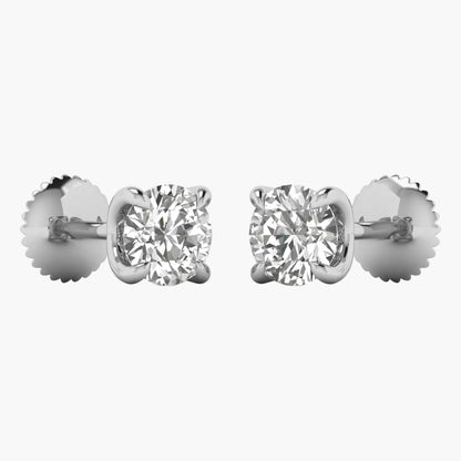 Pair of diamond stud earrings on a white background