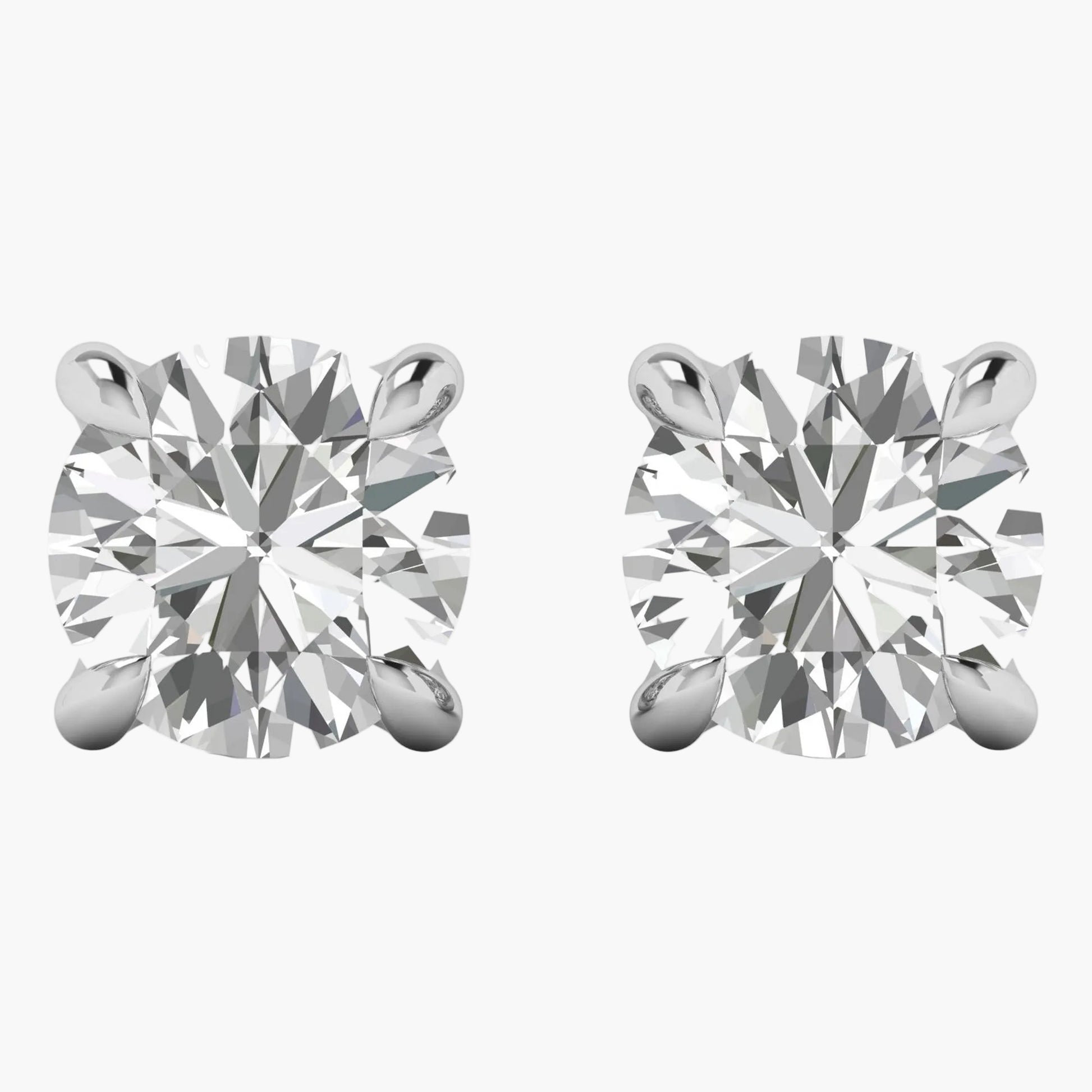 Pair of diamond stud earrings on a white background
