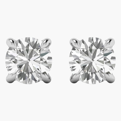Pair of diamond stud earrings on a white background