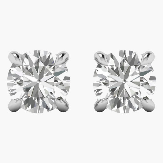 Pair of diamond stud earrings on a white background
