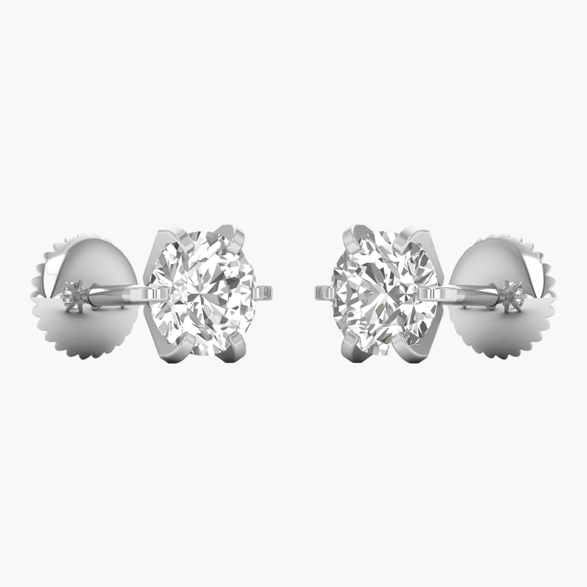 Pair of diamond stud earrings on a white background