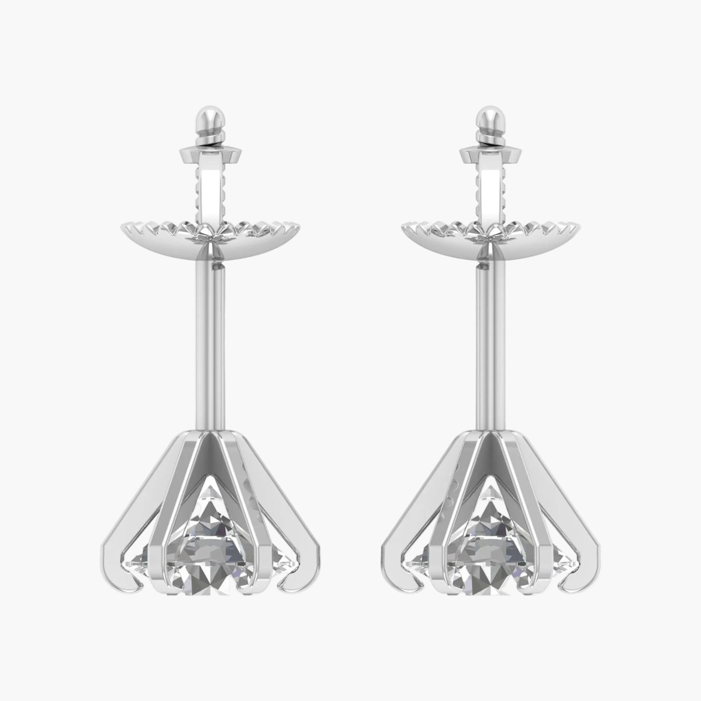 Pair of silver earrings with clear gemstones on a white background