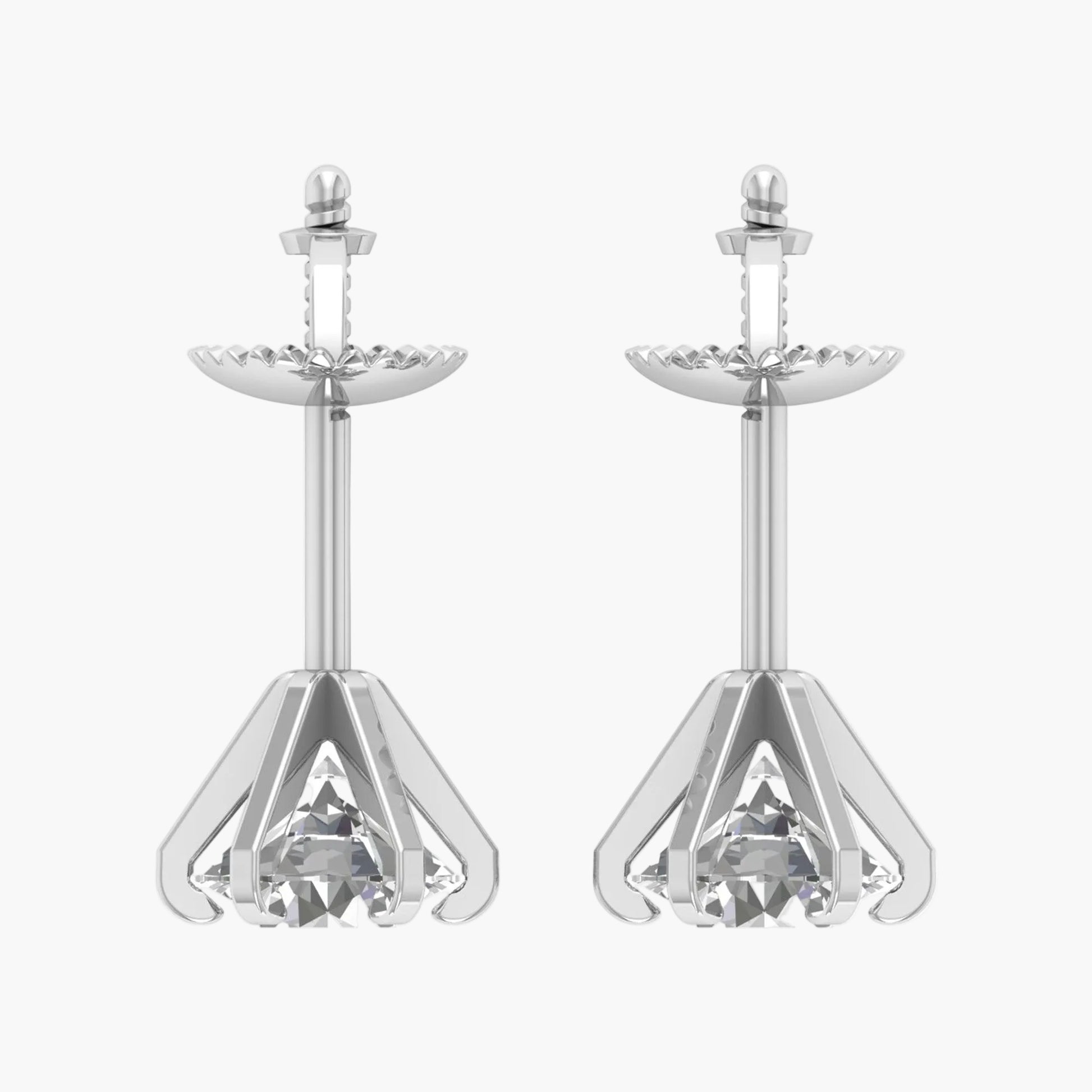 Pair of silver earrings with clear gemstones on a white background