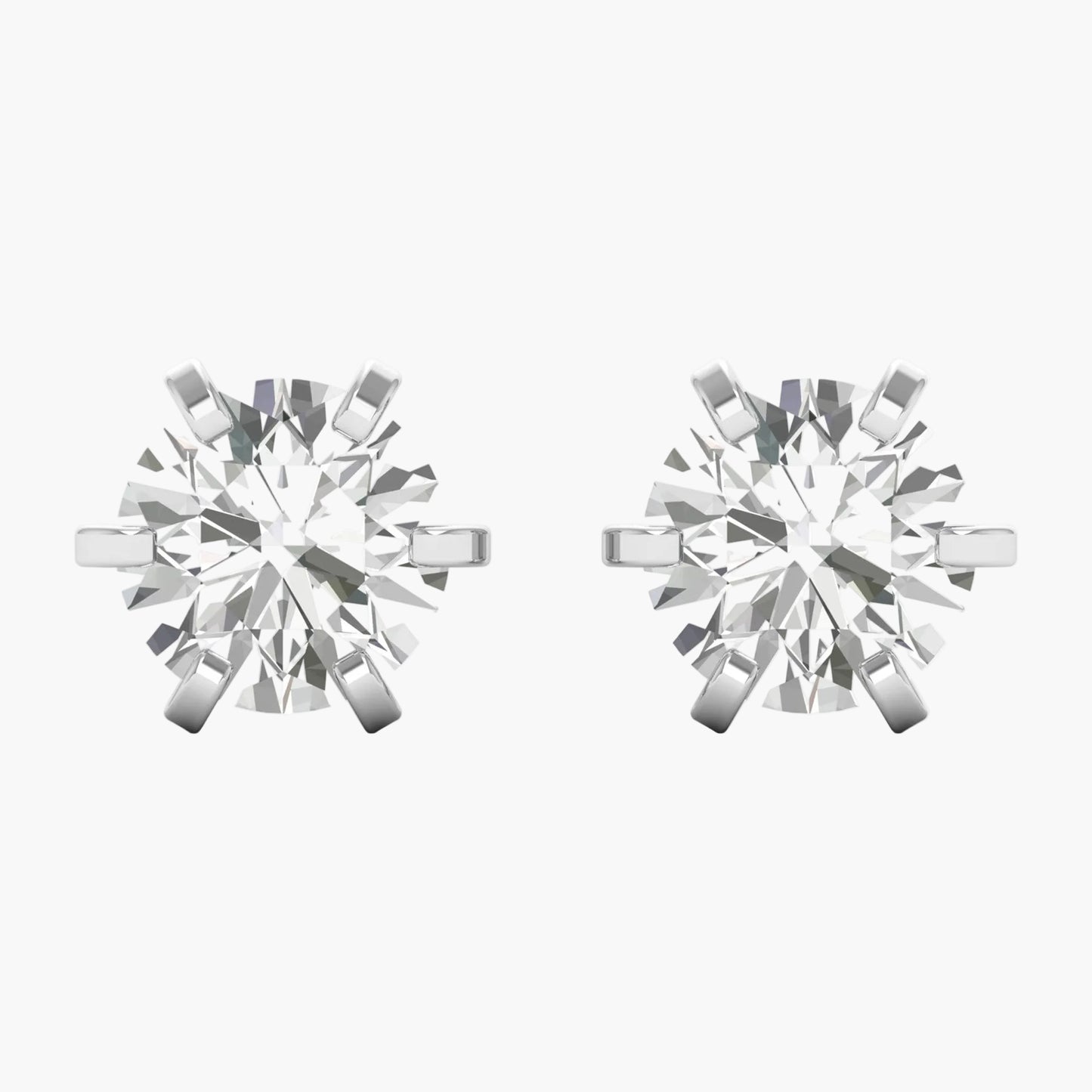 Pair of silver snowflake-shaped earrings on a white background