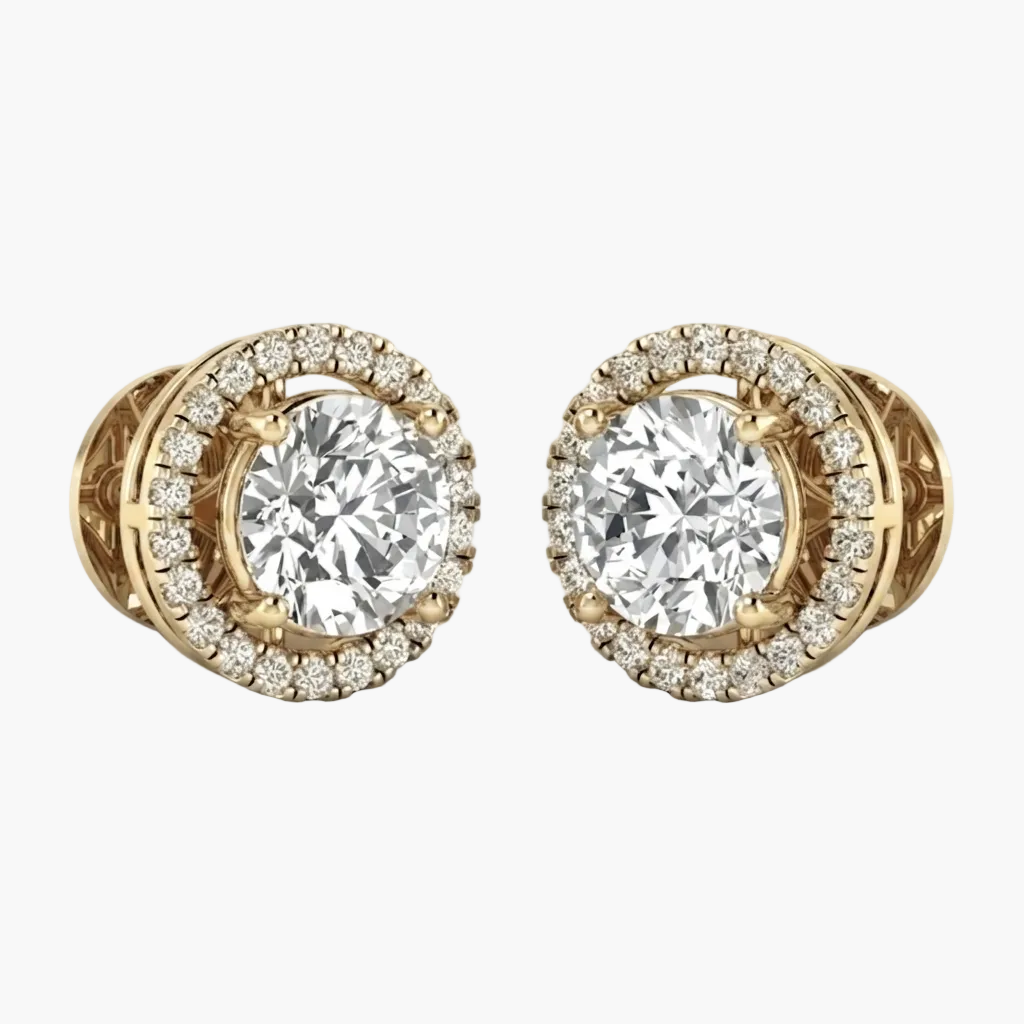 A pair of yellow gold stud earrings featuring a large round brilliant-cut center stone surrounded by a halo of smaller diamonds, shown on a clean white background.