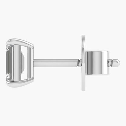 Silver earring with a clear gemstone on a white background