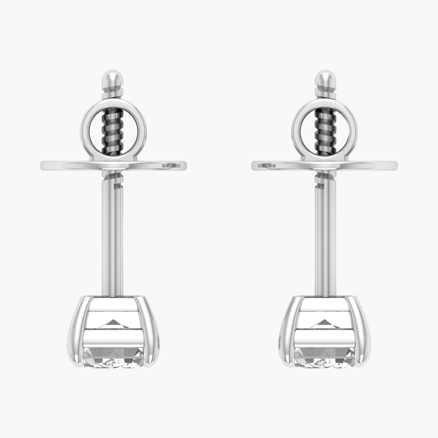 Pair of silver sword-shaped earrings on a white background