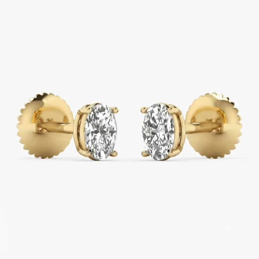 A pair of yellow gold oval stud earrings with marquise-cut clear gemstones, shown against a clean white background.