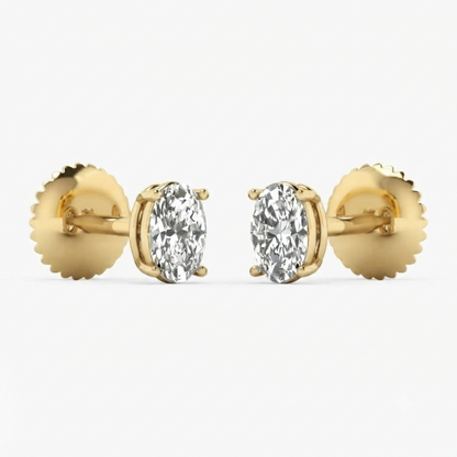 A pair of yellow gold oval stud earrings with marquise-cut clear gemstones, shown against a clean white background.