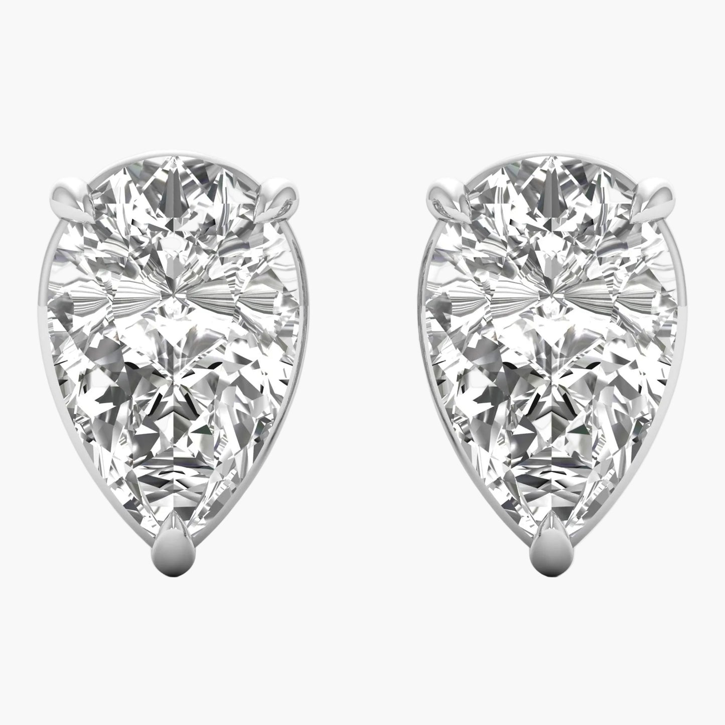 Pair of pear-shaped diamond earrings on a white background