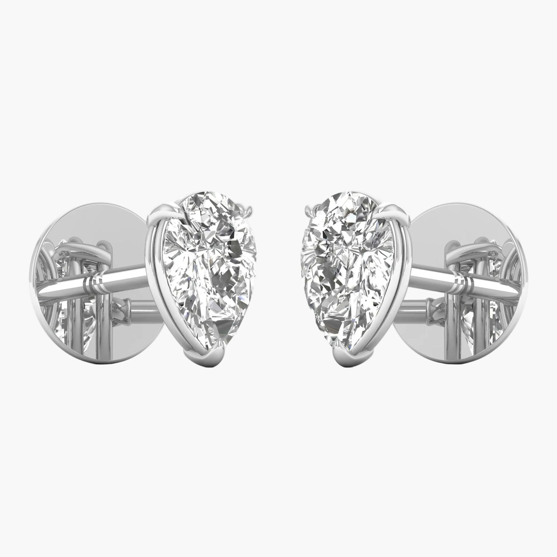Pair of diamond stud earrings on a white background
